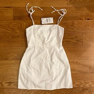 Brand new. White denim dress with shoulder tie. Zara size xs.